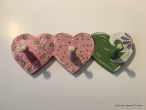 Hand-painted wooden hanger “3 hearts”.